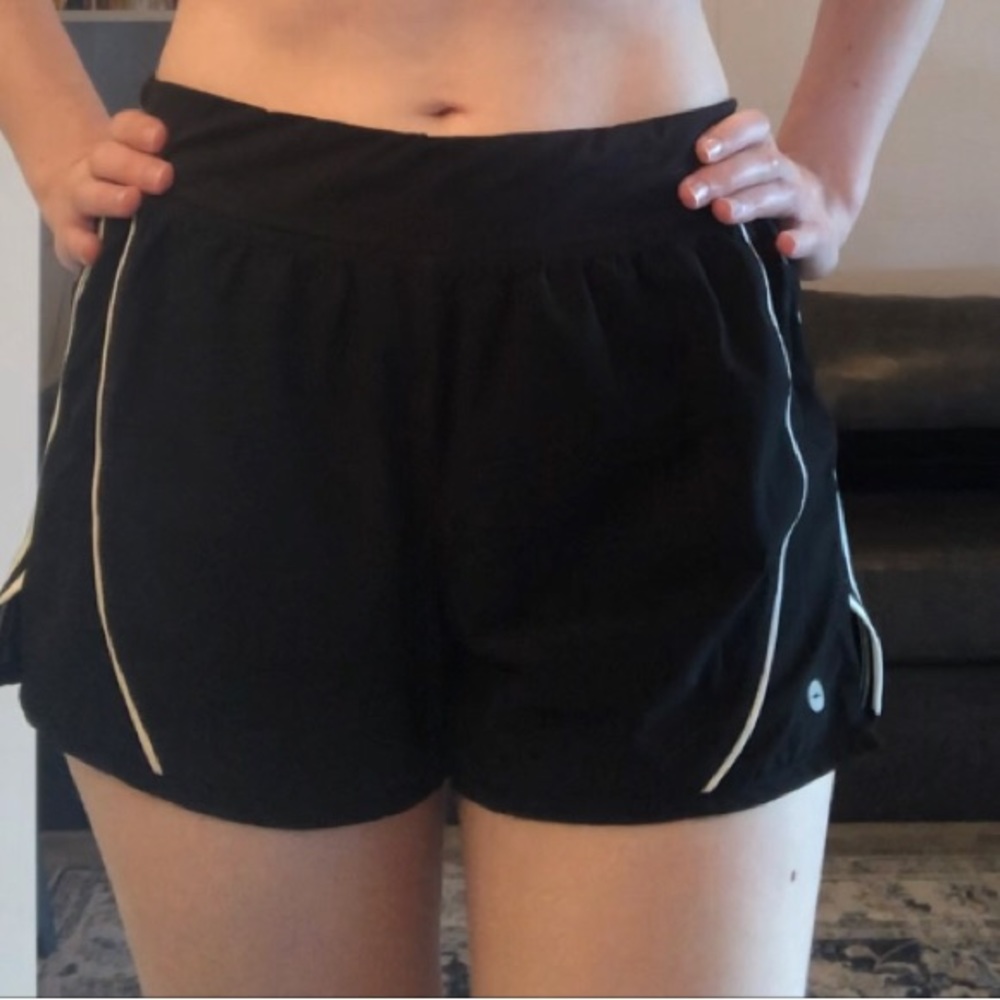 Avia black gym shorts with white side stripes